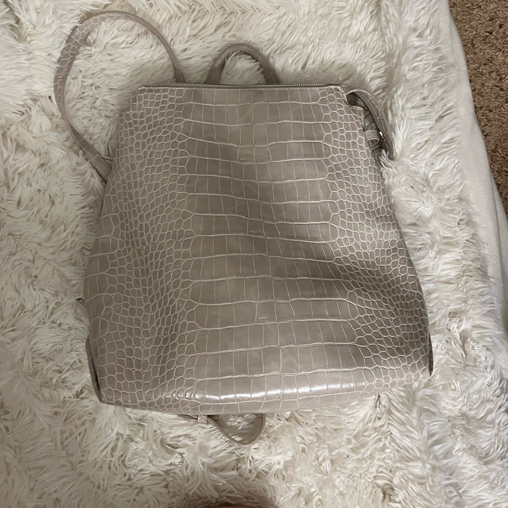 Off white faux tortoise texture backpack. NWOT